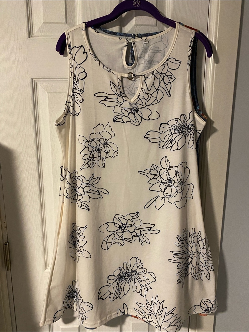 Sleeveless Cream Floral Swing Top